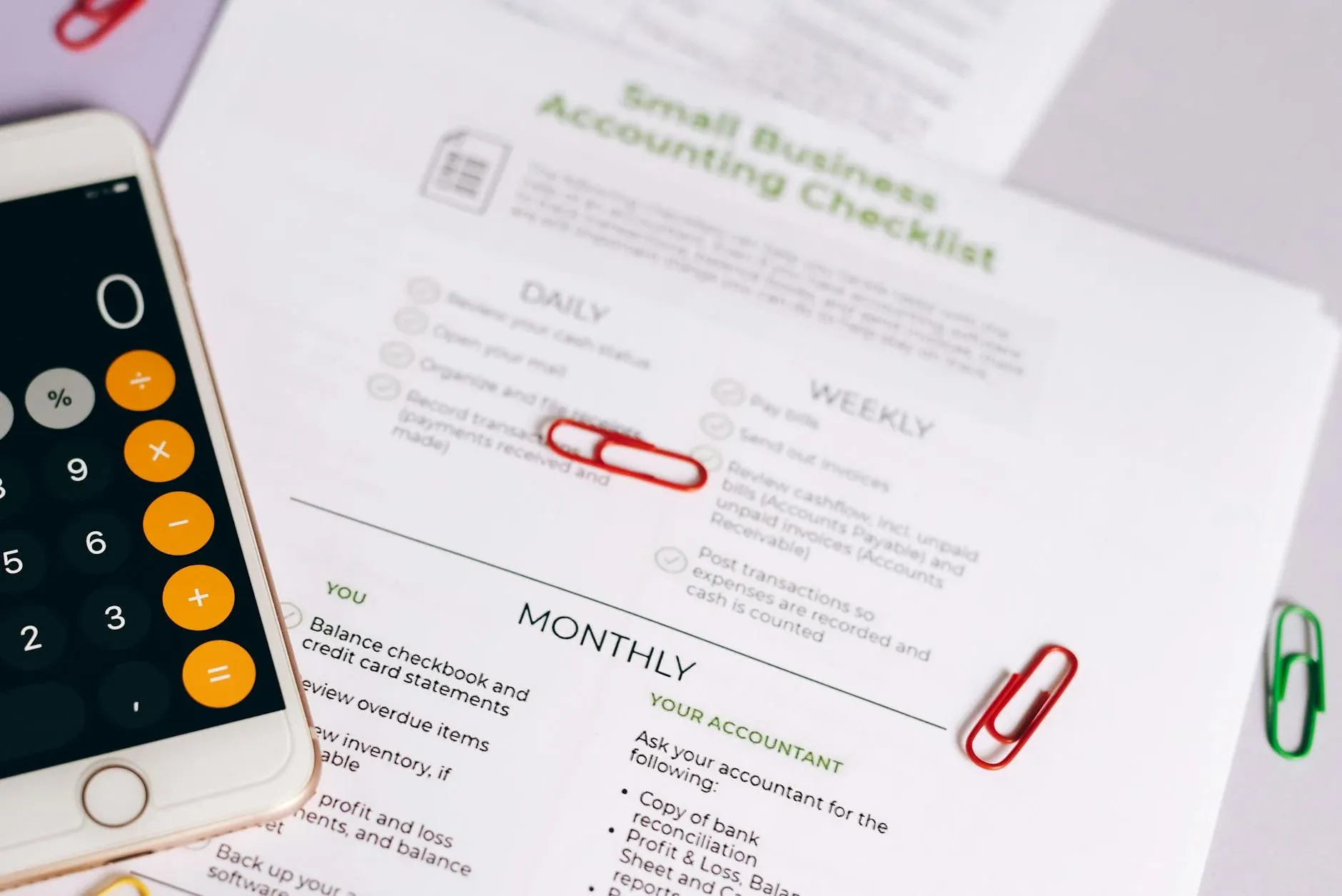 Hand checking off items on a to-do list — startup due diligence checklist India