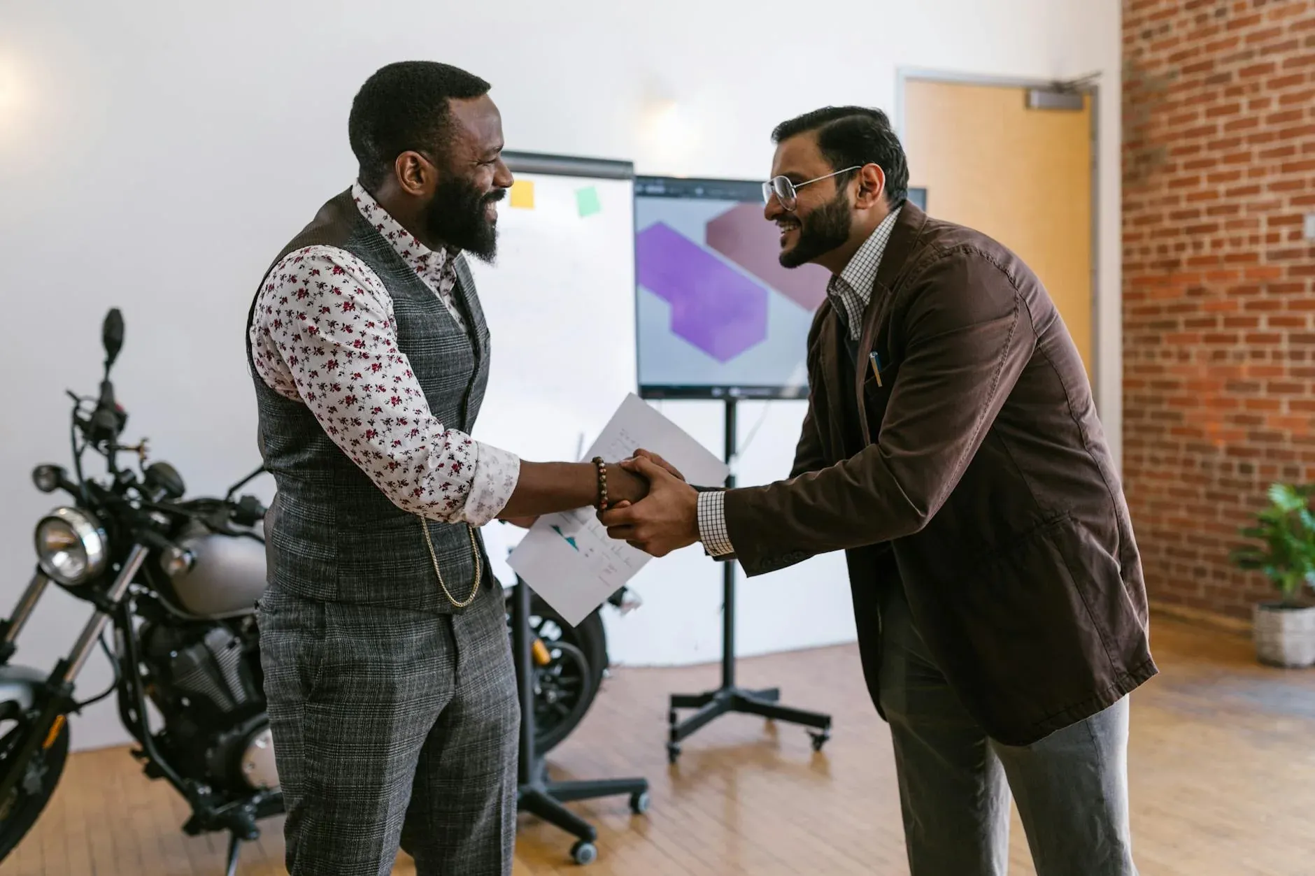 Businessmen handshaking after a deal — what angel investors look for in India