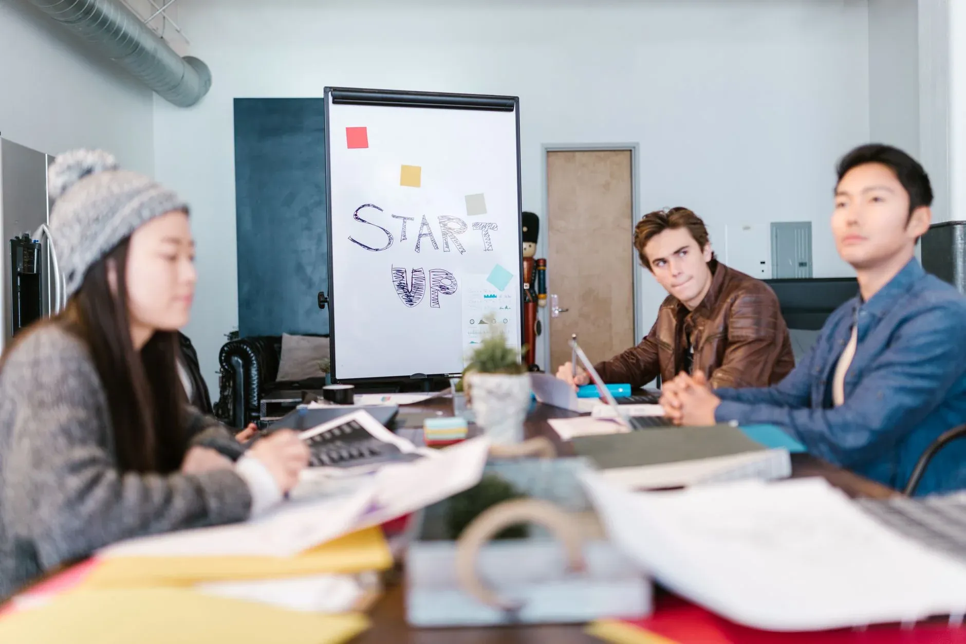 Business people handshake at meeting table — startup evaluation and investor meetings